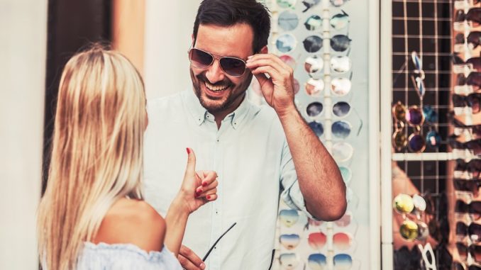 Young smiling couple shopping together. Dating, love, consumerism, shopping, lifestyle concept